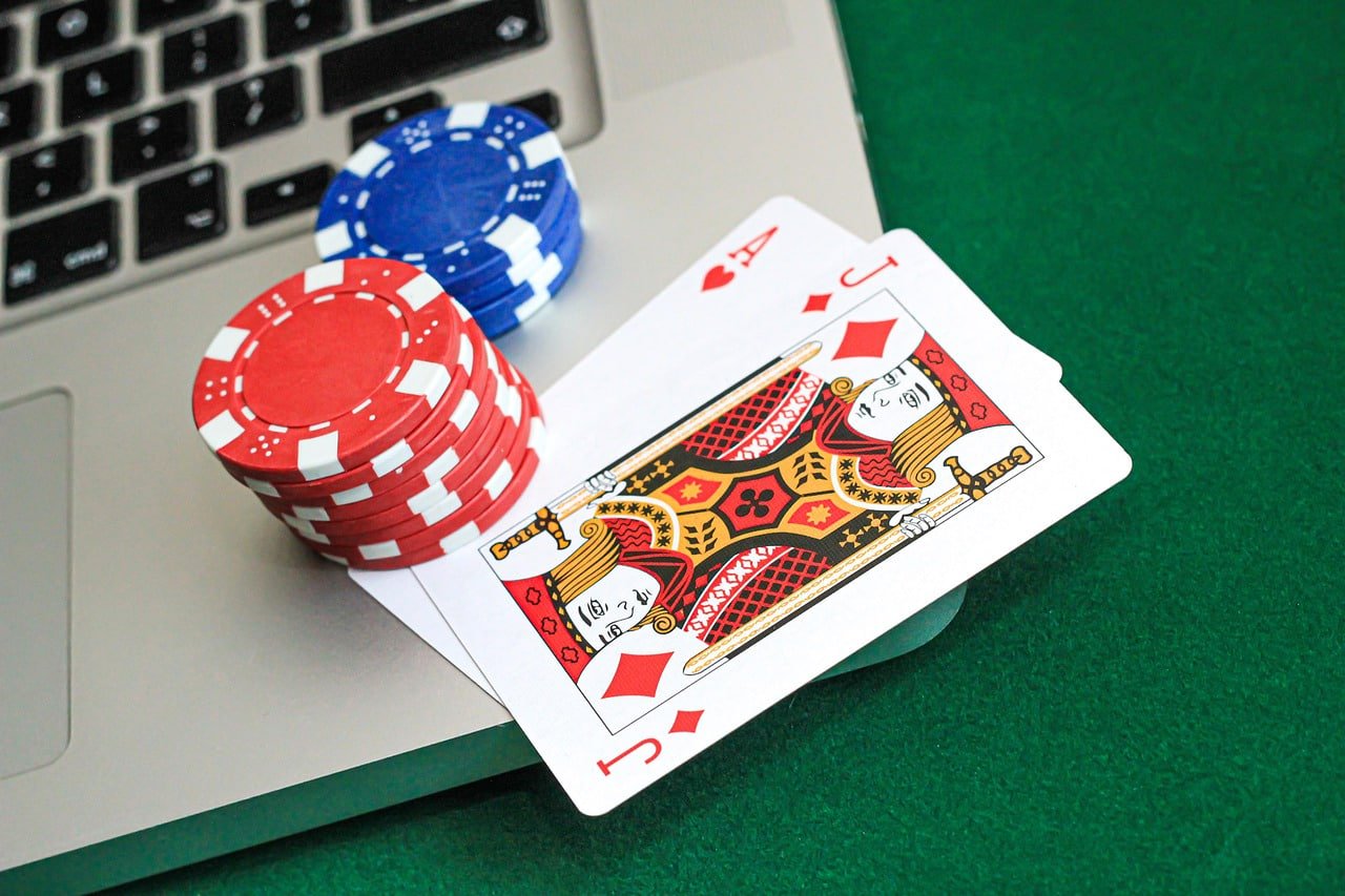 Live dealer at blackjack table with multiple camera angles in professional studio